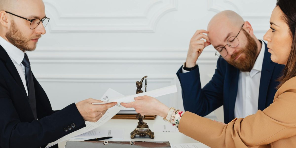 Professionals collaborating to understand and comply with complex real estate regulations.