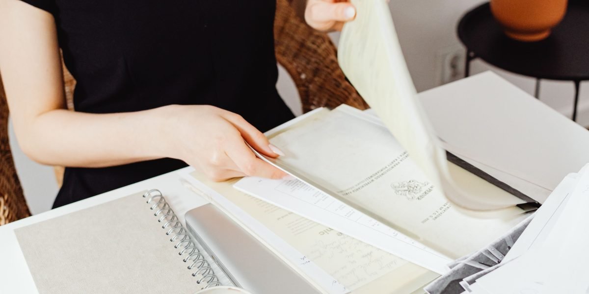 An image depicting well-organized documents and files, emphasizing the importance of meticulous record-keeping for tax compliance.
