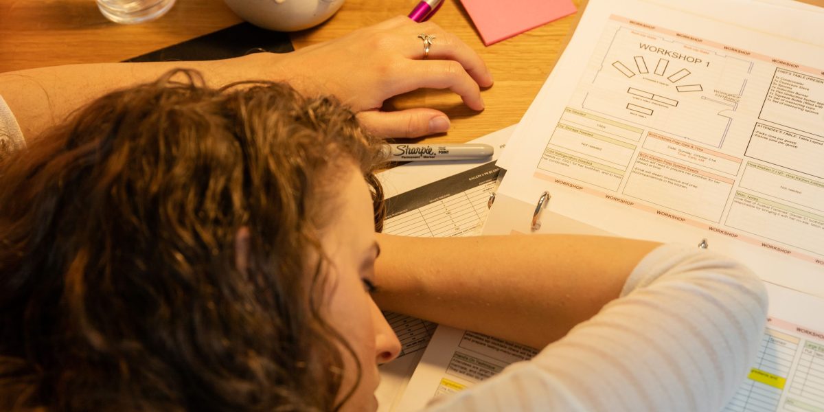 A person visibly overwhelmed by managing multiple tasks and disorganized information.