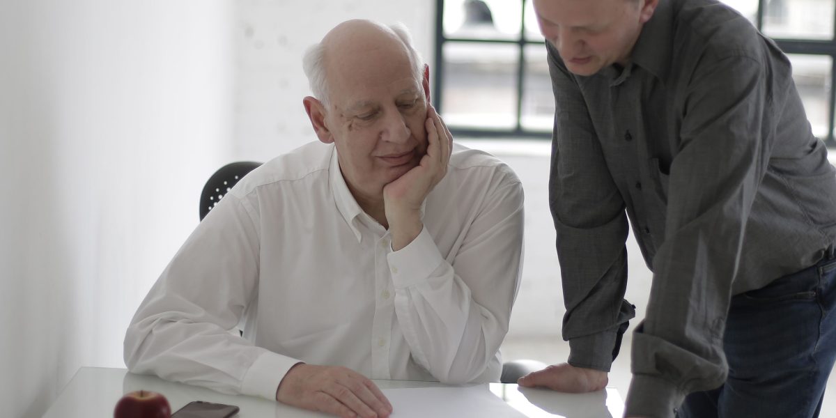 A manager guiding team members through the features and benefits of a new CRM platform.