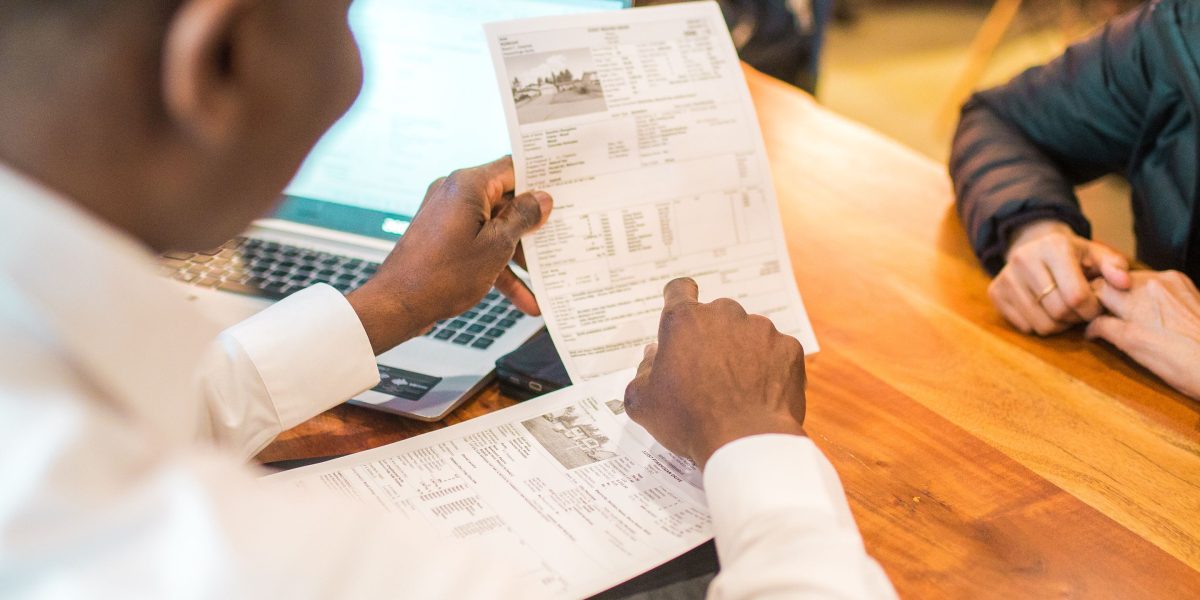 An expert advisor provides clear explanations to a client, emphasizing the importance of informed decisions.