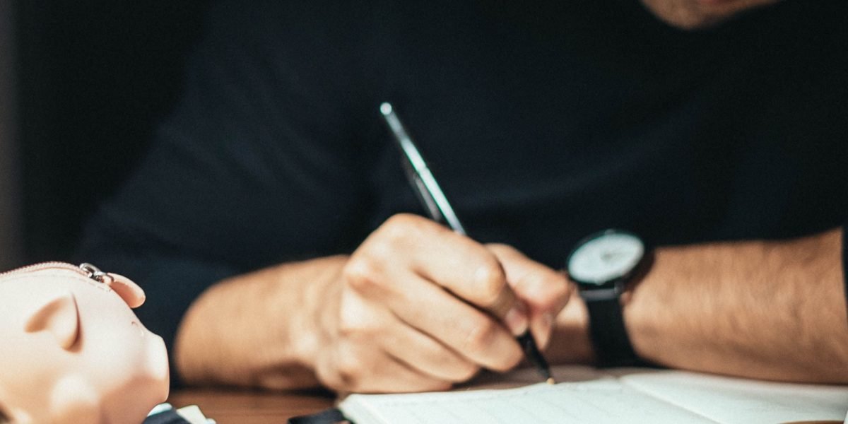 An investor thoughtfully considering different real estate investment options, weighing pros and cons.