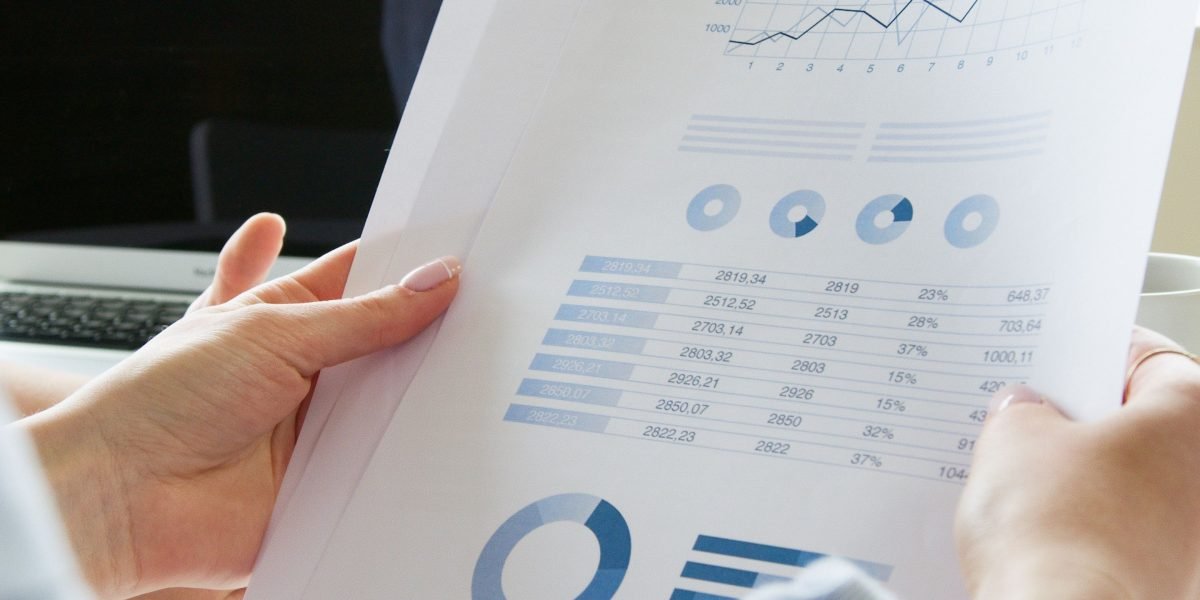 An investor confidently reviewing a financial report, symbolizing thorough due diligence before making investment decisions.