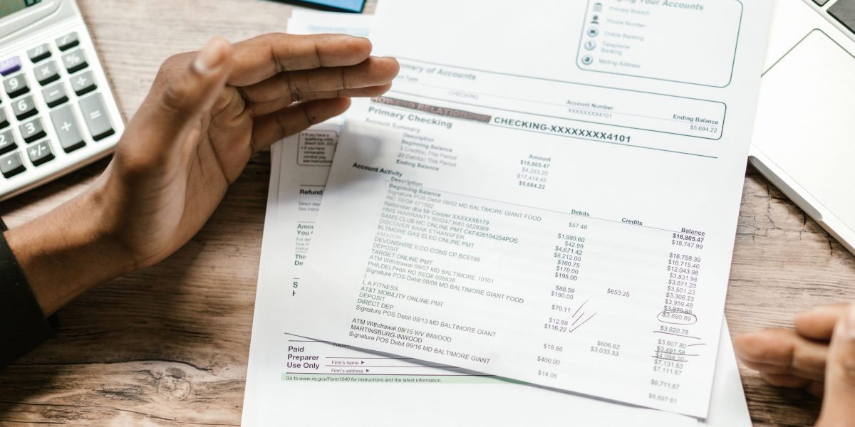 An investor diligently working through calculations to estimate their tax liabilities for Dubai property investments.
