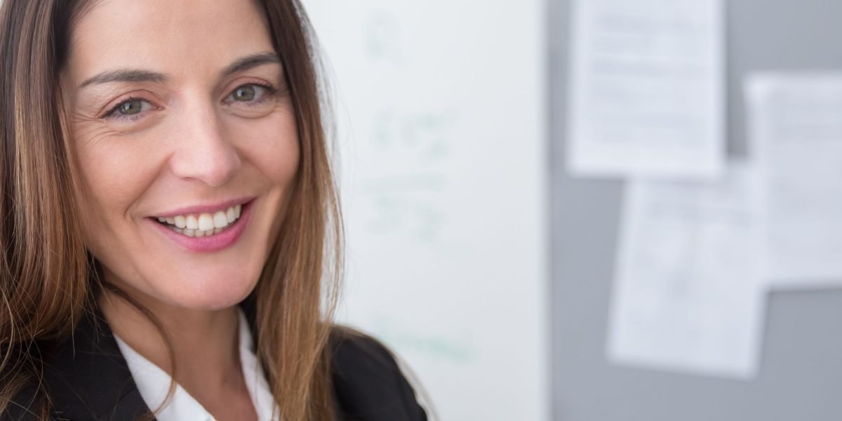A confident professional reflects the clarity and improved decision-making achieved with a robust real estate CRM.