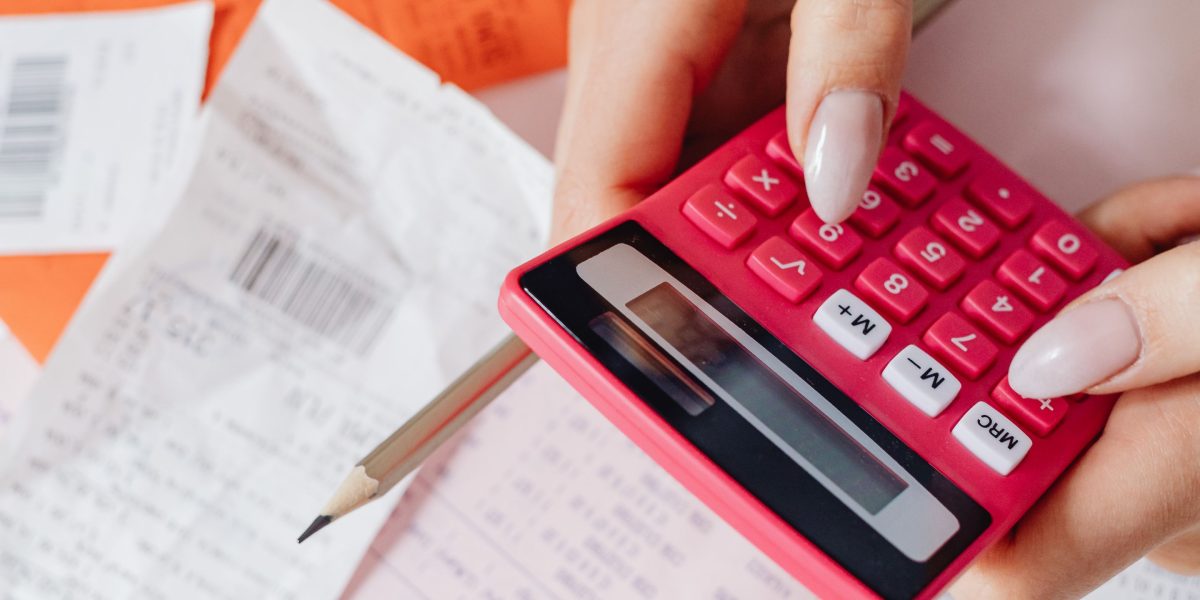 A financial professional meticulously calculating figures to optimize tax outcomes.