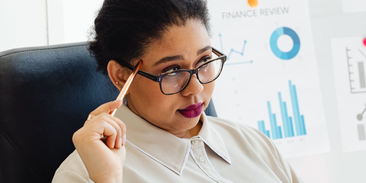 A person confidently analyzing charts and reports, embodying the clarity and insight gained from CRM marketing analytics.