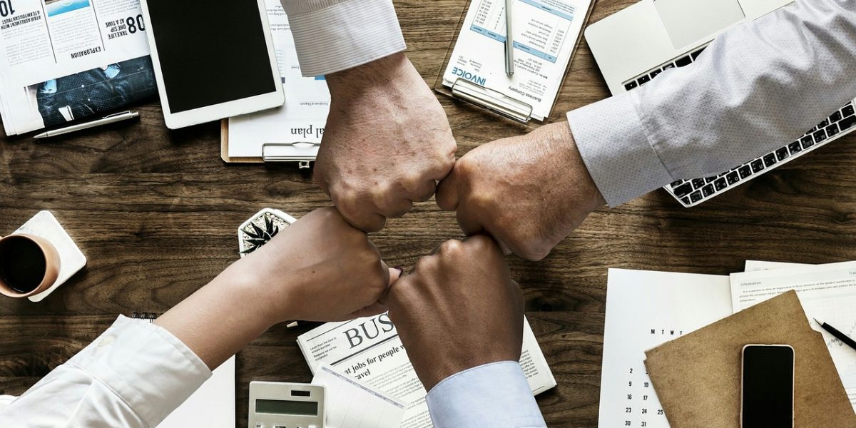 A team collaborates with a tax advisor, ensuring their property investment strategy is tax-efficient and compliant.