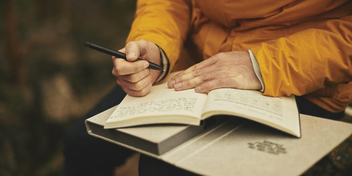 A person diligently organizing financial documents, emphasizing the importance of meticulous record-keeping for tax compliance.