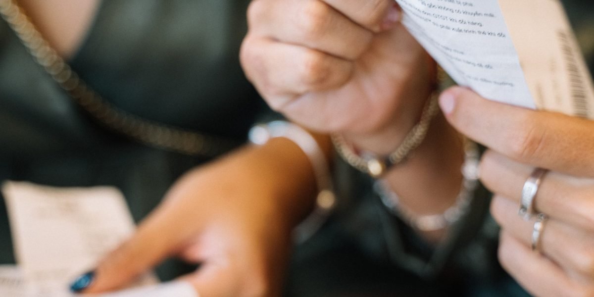 A person diligently organizing physical and digital receipts and financial records, emphasizing the importance of meticulous documentation for deductions.