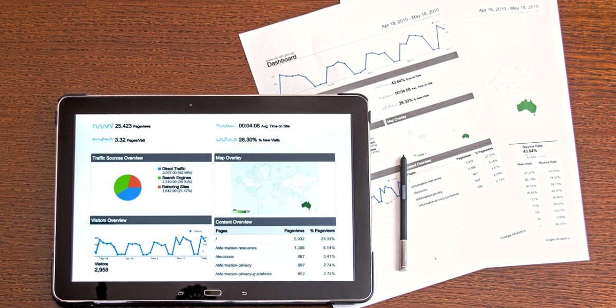 A business leader assesses performance metrics and reports to gauge the return on investment from CRM.