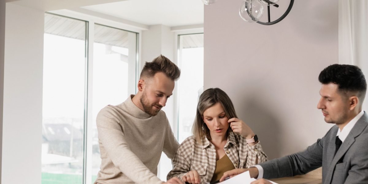 Professionals meticulously reviewing legal and financial documents, an essential part of property due diligence.